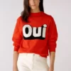 Soft wool-modal blend Straight cut jumper With indicated stand-up collar Statement motif: Vintage Oui logo knitted in black and white Ribbed hem and arm